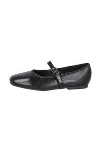 Zapato Mary Jane de cuero negro con punta redondeada, correa ajustable y un tacón bajo y plano. Textura suave y diseño minimalista.