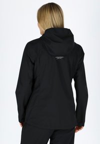 Black waterproof jacket featuring a hood, long sleeves, and a subtle logo on the back. Smooth texture with a fitted design.
