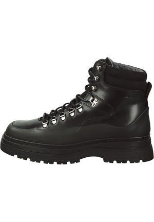 Black leather hiking boot with a high ankle, padded collar, metal eyelets, and rugged outsole for traction. Laces run through reinforced loops.