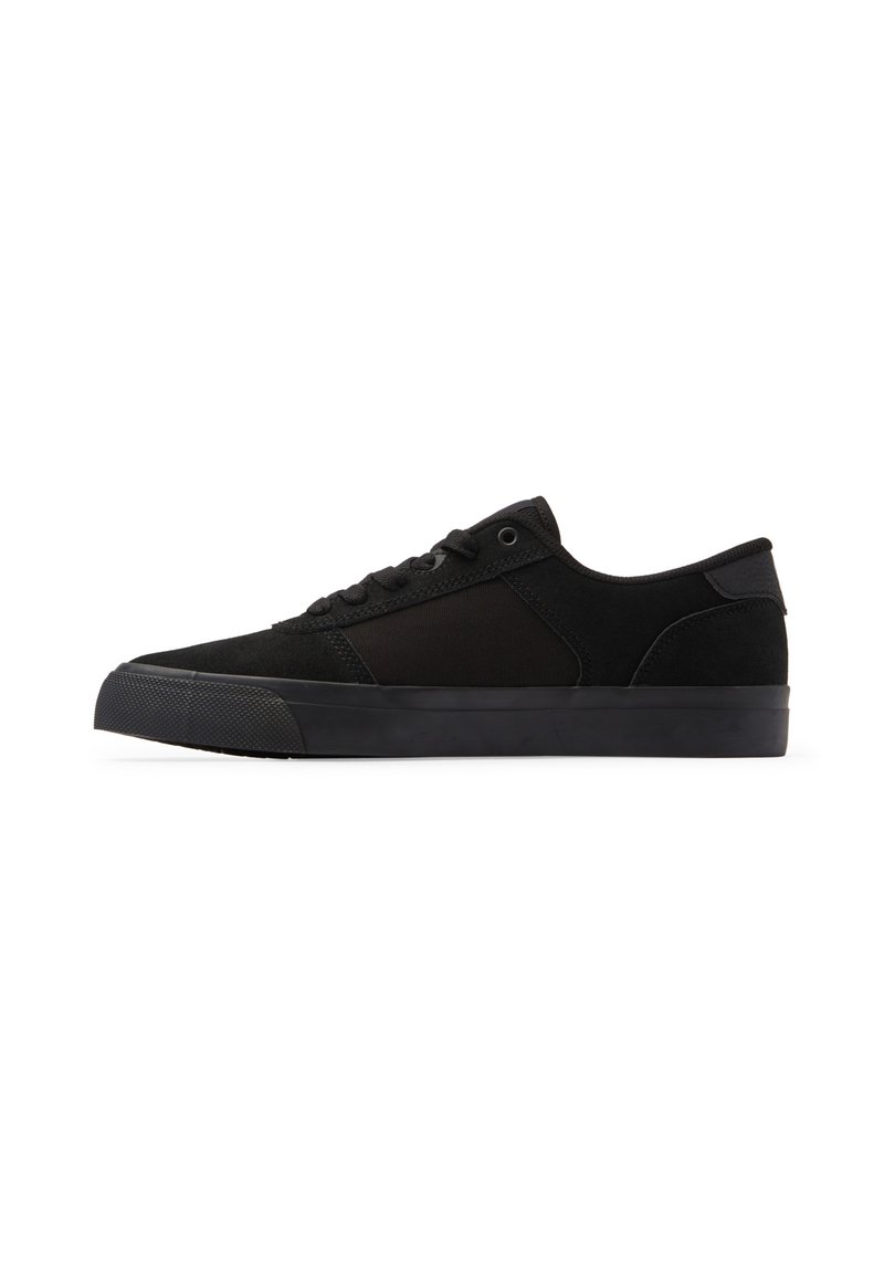 Black sneakers with a combination of suede and textile materials. Low-top design, round toe, flat rubber sole with textured pattern.