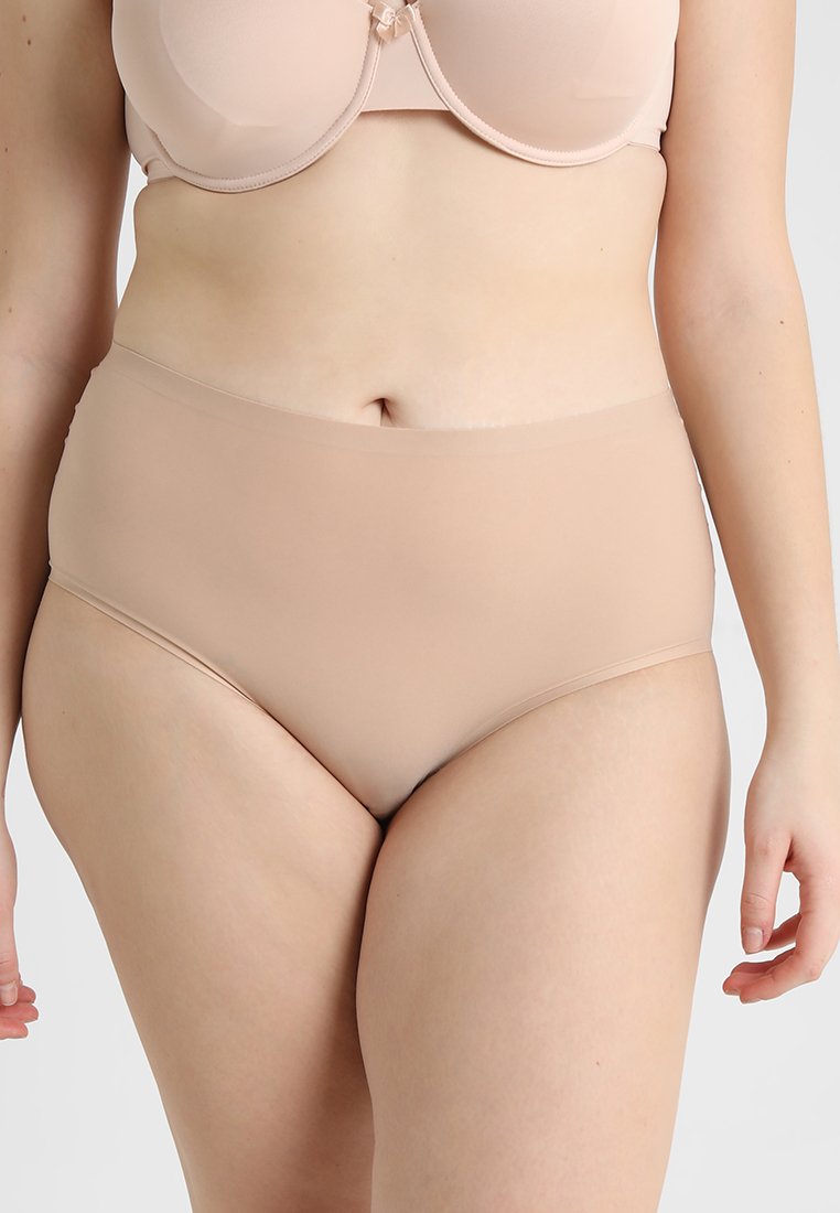 High-waisted beige underwear made from smooth fabric with a seamless design and gentle waistbands for comfort.