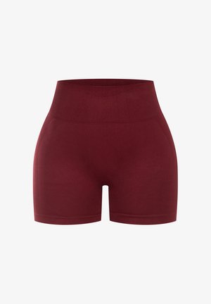 Shorts taille haute bordeaux en tissu extensible, dotés d'un design sans couture et d'une texture lisse, adaptés pour le sport.