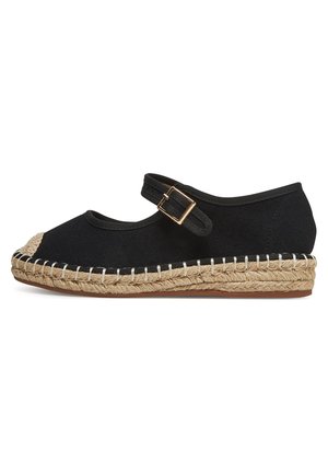 Black canvas espadrille with round toe, ankle strap, and jute-wrapped midsole. Features contrast stitching along the sole.