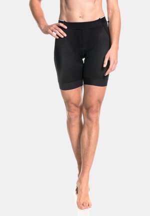 Schwarze Sportshorts mit einem strukturierten Mesh-Muster, elastischem Taillenbund und figurbetonendem Design, das bis zur Mitte des Oberschenkels reicht.