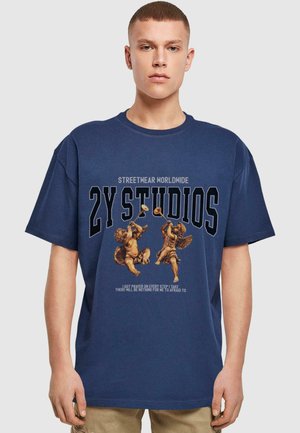 Navy blue oversized t-shirt made of cotton, featuring printed angels in a classic design with text "2Y STUDIOS" in bold. Short sleeves.