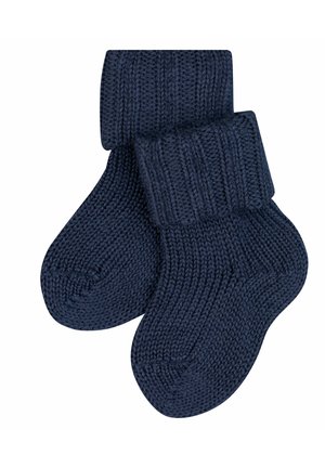 Chaussettes en tricot bleu marine avec des bord-côtes, présentant une surface lisse et texturée et un bout arrondi. Conçues pour la chaleur et le confort.