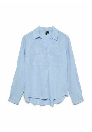 Helehall sinine pika varrukaga särk, millel on nööpidega esikinnitus, kaks rinnataskut ja kergelt kõverdatud serv. Valmistatud tekstuurse, kergest kangast.