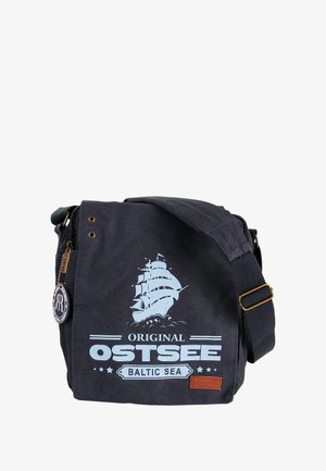 Dark blue canvas shoulder bag with a white ship graphic, "Original Ostsee Baltic Sea" text, a zipper closure, and an adjustable strap.