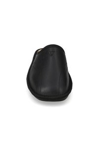 Scarpina nera senza lacci con tomaia in pelle liscia, punta arrotondata e dettagli di cucitura visibili lungo i lati. Logo sottile impresso vicino alla parte superiore.