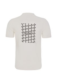Krämfärgad t-shirt med kort ärm och ett svart grafiskt mönster samt texten "KARL LAGERFELD" centrerad på baksidan. Mjuk och lättviktsmaterial.