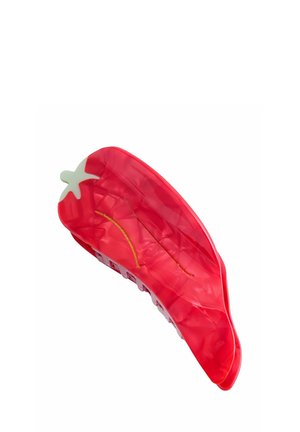 Roter Kunststoff-Haarclip in Form einer Chilischote mit glänzendem Finish, weißen Akzenten und strukturierter Oberfläche für besseren Halt.
