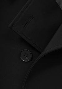 DOUBLE BREASTED - Trenchcoat - black
