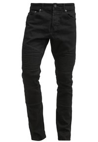 Jeans de denim negro con paneles de rodilla acanalados, corte slim, cierre zip, cuatro bolsillos y detalles de costura en contraste.
