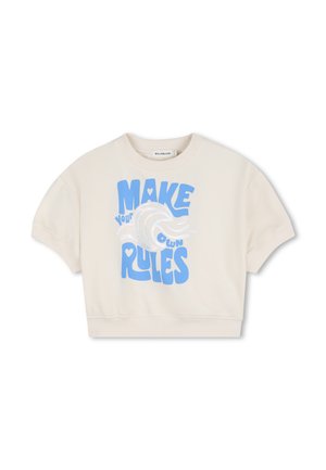 Sweat-shirt court crème avec un motif graphique bleu et le texte « FAITES VOS PROPRES RÈGLES ». Manches courtes et ourlet côtelé.
