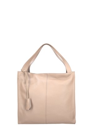 Sac fourre-tout en cuir beige à texture lisse, avec des anses larges et une fermeture à cordon, présentant des détails de couture subtils sur le devant.