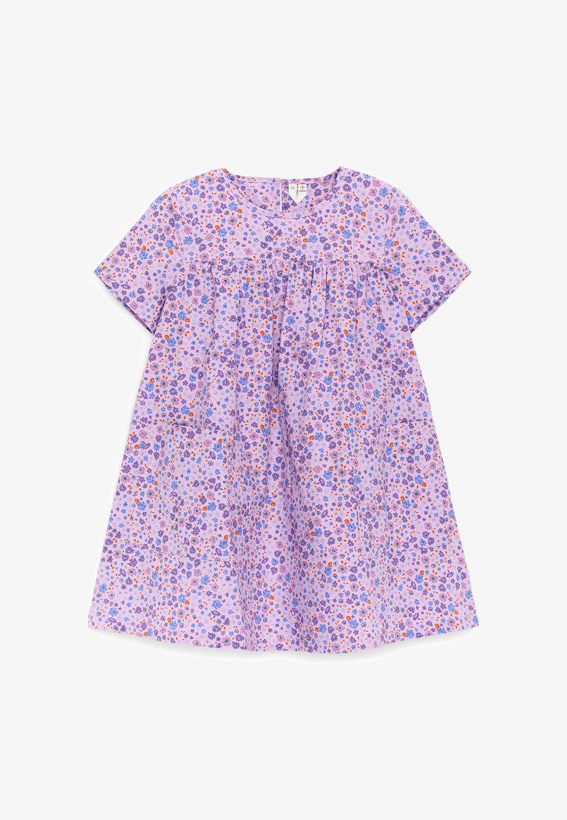 Robe lilas à manches courtes, col rond, taille froncée, grandes poches devant et petit motif floral violet, bleu et orange.