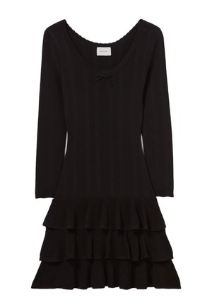 Robe en tricot noir à côtes avec un large décolleté en scoop, des manches longues et un ourlet évasé à volants avec trois niveaux. Inclut un nœud décoratif.