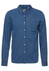 Pánská modrá džínsová košile s dlouhým rukávem, texturovaným vzorem, předními knoflíky, špičatým límcem a náprsní kapsou s červenou etiketou.