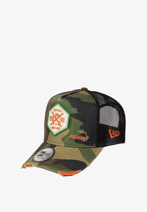 Camo-patterned cap with a curved visor, mesh back, and an embroidered logo patch in orange and green. It features distressed accents.
