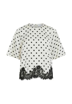 Valge polka dot pluus mustade täppidega, lühikeste varrukatega, ümara kaelusega ja musta pitsi äärega alumisel äärel. Sile kangaspind.