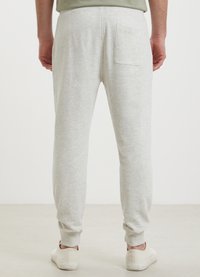 Calliope JOGGER - Jogginghose - bianco