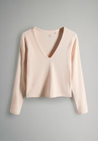 Dlhý rukáv, top s V-výstrihom z jemnej ružovej rebrovanej látky. Obsahuje skrátený dizajn s hladkým povrchom a obyčajnými okrajmi.