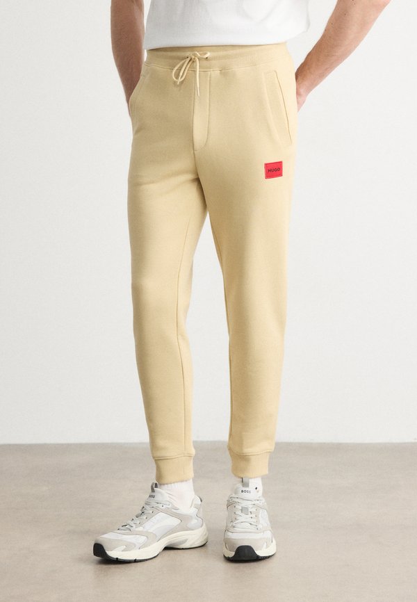 DOAK - Tracksuit bottoms - beige