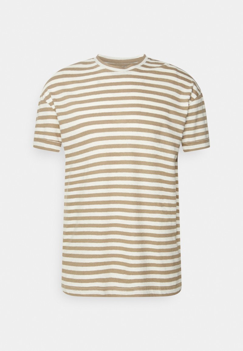 Pruhované tričko z béžové a bílé bavlny, s kulatým výstřihem a krátkými rukávy. Horizontální pruhy jsou rovnoměrně rozloženy po látce.