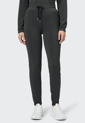 Dunkelgraue Jogginghose mit elastischem Bund, Kordelzug, Seitentaschen und gerippten Bündchen. Weiches Material mit körperbetonter Passform.
