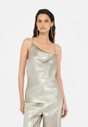 Metallic silver sleeveless top with a cowl neckline, featuring thin straps and a smooth, textured fabric.