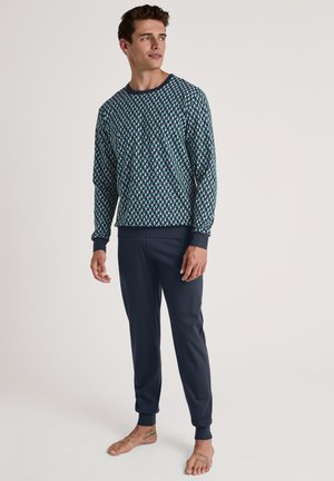 Navy blue pajama set featuring a long-sleeve top with a geometric pattern and matching cuffed pants, made of soft material.