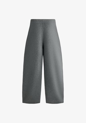 Pantalons larges gris en tissu texturé, dotés d'une taille côtelée. Coupés au-dessus de la cheville avec une coupe décontractée.