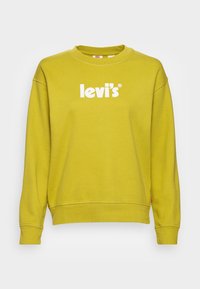 Sudadera amarilla de algodón con cuello redondo, con un prominente logo blanco "Levi's" en el pecho y puños de canalé.