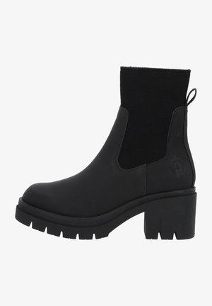 Bottine noire à talon chunky, semelle texturée et panneaux latéraux élastiques, conçue pour un port décontracté ou semi-formel.