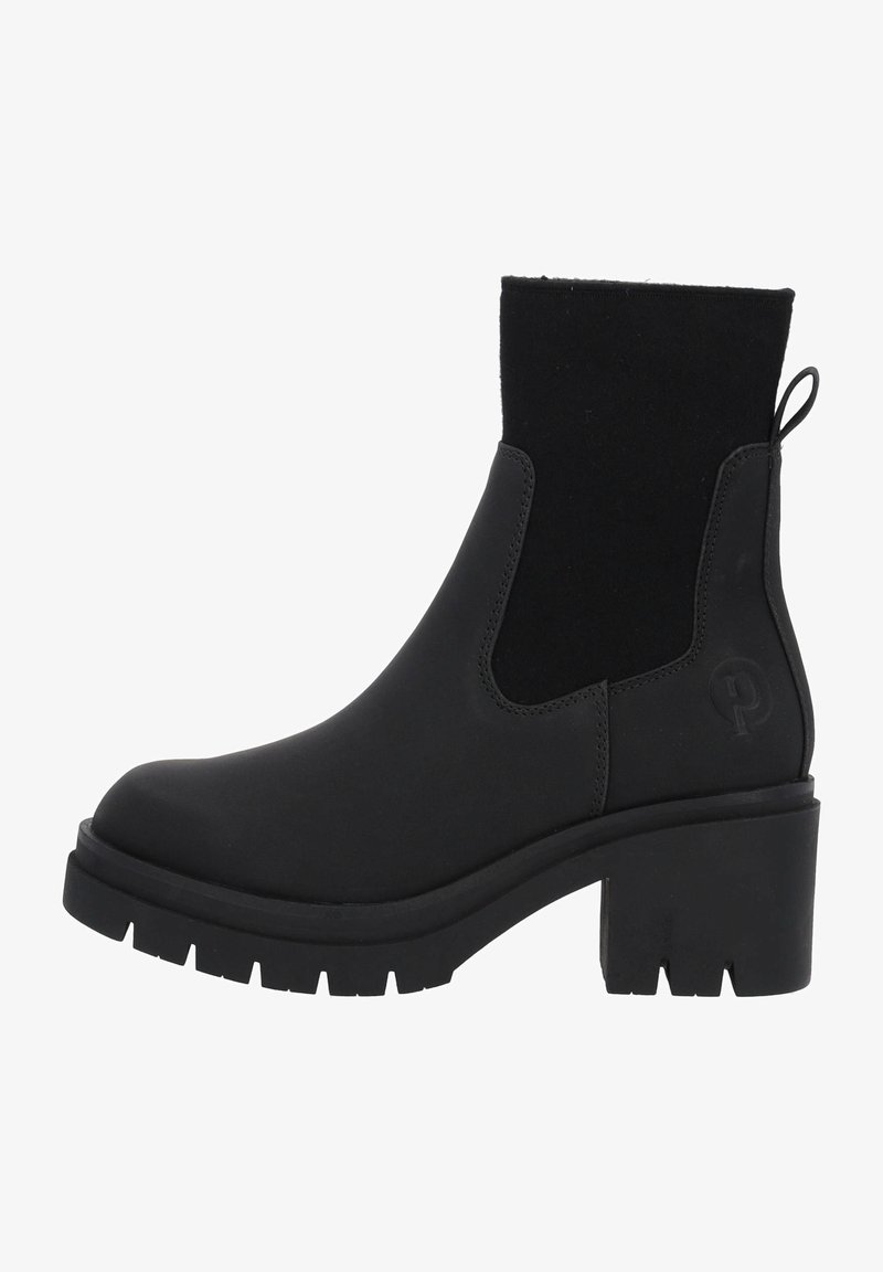 Bottine noire à talon chunky, semelle texturée et panneaux latéraux élastiques, conçue pour un port décontracté ou semi-formel.