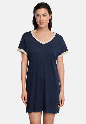Navyblauwe nachtjurk met V-hals, korte mouwen en crèmekleurige bies. Gemaakt van zachte stof met een losse pasvorm en zijsplitten voor extra comfort.