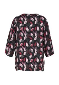 Blouse noire à motif de feuilles dans des tons de rose, bordeaux et violet. Coupe ample, manches trois-quarts et encolure ronde.