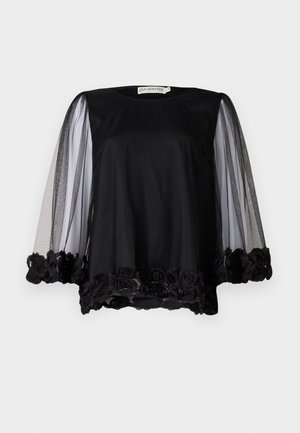 Sort bluse med gennemsigtige meshærmer og blomsterlyse trim i kanten. Blødt stof med en løs pasform og rund halsudskæring.
