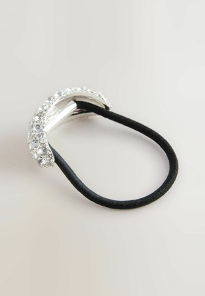 Hair tie with a black elastic band, featuring a silver-toned metallic accent adorned with clear, round rhinestones along the top.