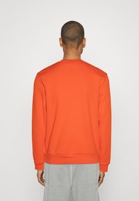 Lacoste UNISEX - Sudadera - sunrise