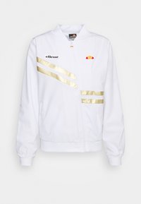 Weißer Zip-Jacke mit goldenen Streifen und schwarzem Logo. Verfügt über einen Stehkragen und elastische Bündchen. Glatte Stoffoberfläche.
