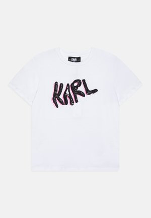 Witte katoenen t-shirt met een zwart en roze pailletten "KARL" logo op de voorkant. Klassieke ronde hals met korte mouwen.