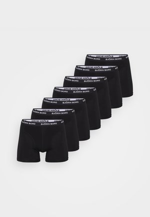 Bóxer negro con una cinturilla elástica blanca que muestra "BJÖRN BORG." La tela parece suave, y ocho pares están dispuestos en una fila.