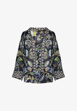 Blouse sombre à motif floral avec manches larges, décolleté en V profond bordé d'une garniture géométrique complexe et détails de poignets assortis.