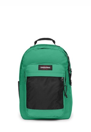 Sac à dos Eastpak vert avec une poche avant en mesh noire et une poignée supérieure, présenté sur fond blanc.