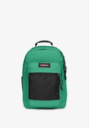 Sac à dos Eastpak vert avec une poche avant en mesh noire et une poignée supérieure, présenté sur fond blanc.