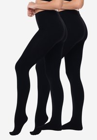 Leggings neri con una texture liscia e opaca, vita alta e design aderente, che mostrano uno stile a lunghezza intera senza cuciture visibili.