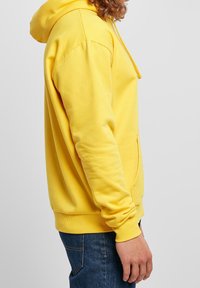 Karl Kani Felpa con cappuccio - yellow