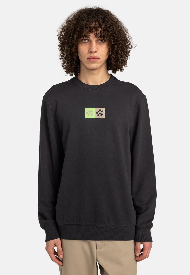 Black sweatshirt with a crew neck, featuring a green and beige rectangular graphic on the chest. Made from soft, textured fabric.
