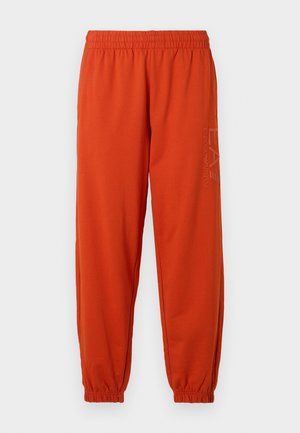 Orange sweatpants with elastic waistband and cuffs. Features a printed logo on the side. Made from a soft, textured fabric.